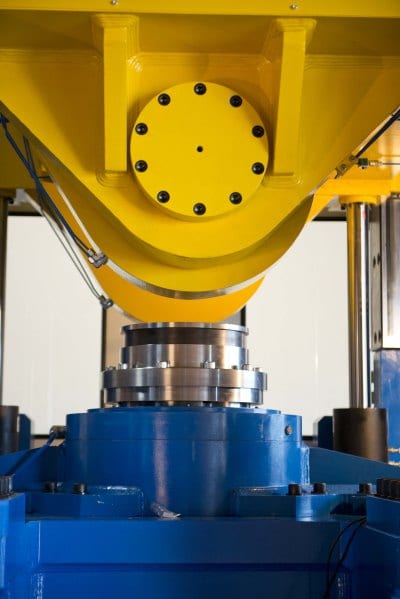 The unique operation of this MJC rotary forging press involves the application of pressure on a small portion of material at a time, reducing stress and saving up to 90% in material, compared to subtractive machining from a solid blank