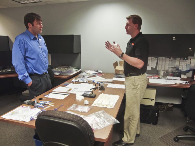 Matt Proske, Vice President, SIGMA Plastic Services (Left) and Stafford Frearson, Project Engineer at Tessy Plastics, have a conversation at Tessy Plastics in Elbridge, NY.