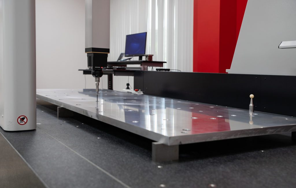 Large scale CMM providing a full dimensional layout report