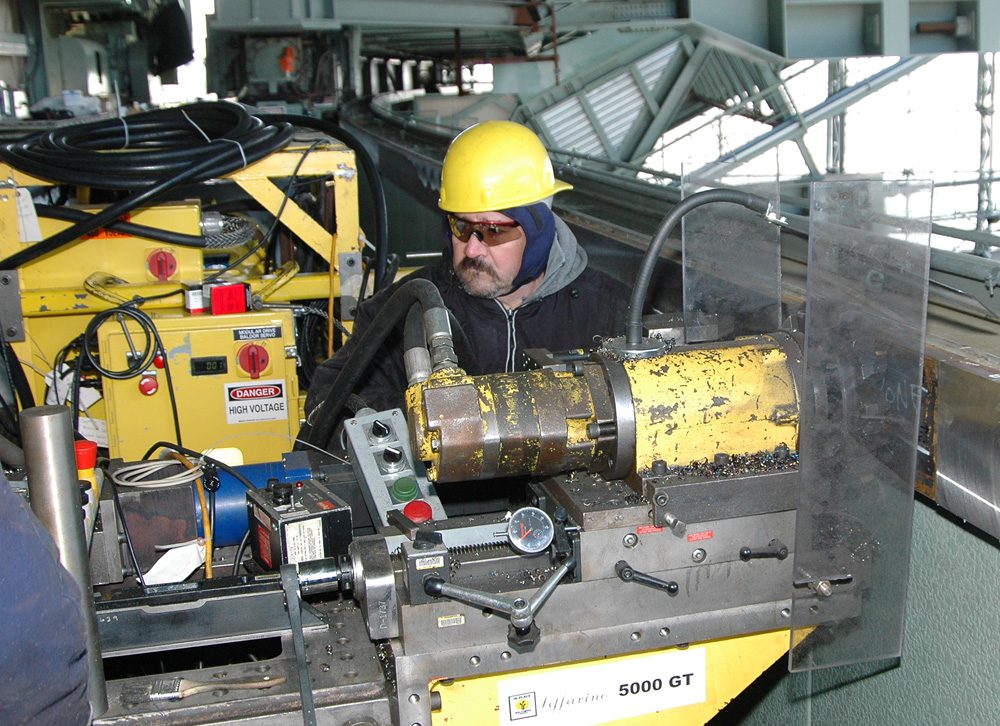 IPM technician performing girder machining