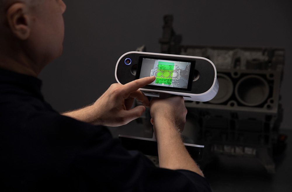 Man scanning with the 2022 Artec Leo 