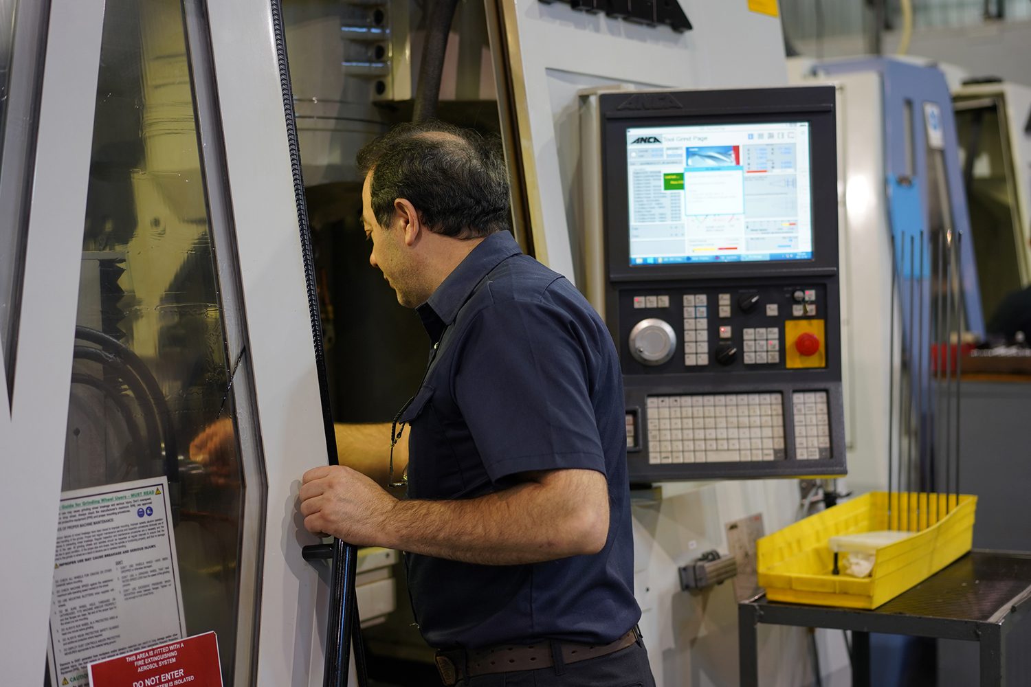 Skilled operator Antonio performing a tool change after a completed cycle