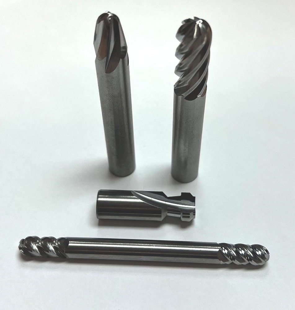 These ball nose end mills (for machining hip stems) feature a perfect transition from the ball radius to the OD, and an end face gash that meets exactly at the center