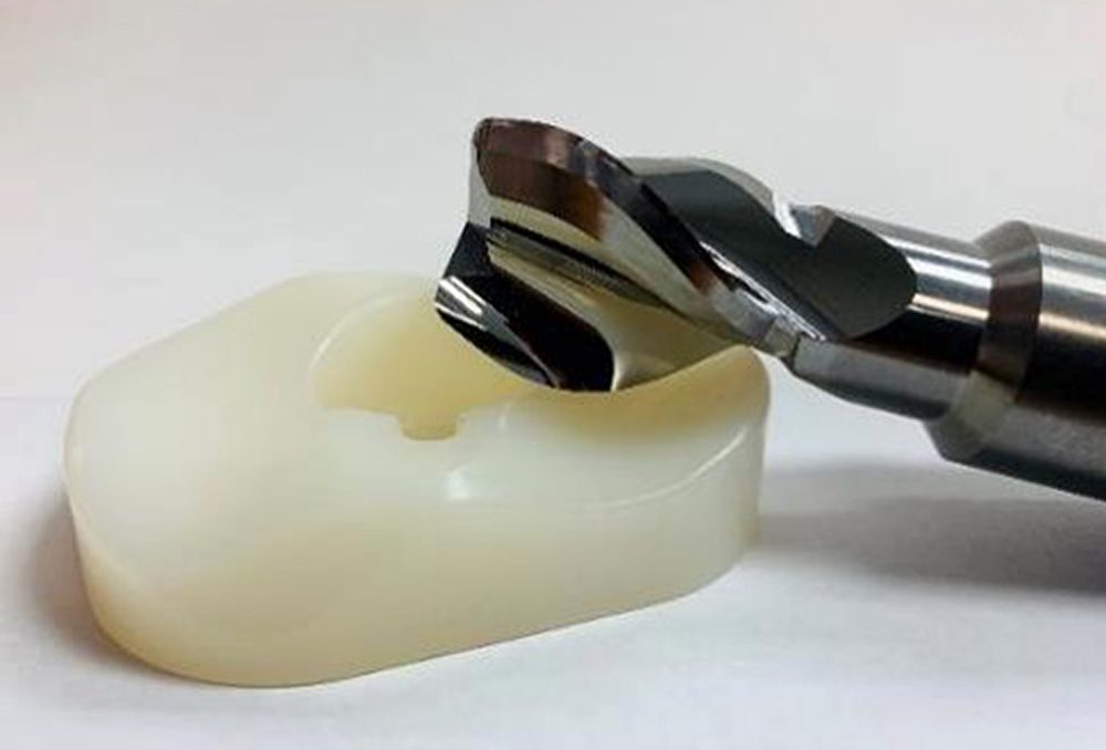 ARCH Cutting Tools produces a unique 3-flute carbide helical cutter that delivers unequaled part finish, higher throughput, and longer tool life in machining a polyethylene tibial insert