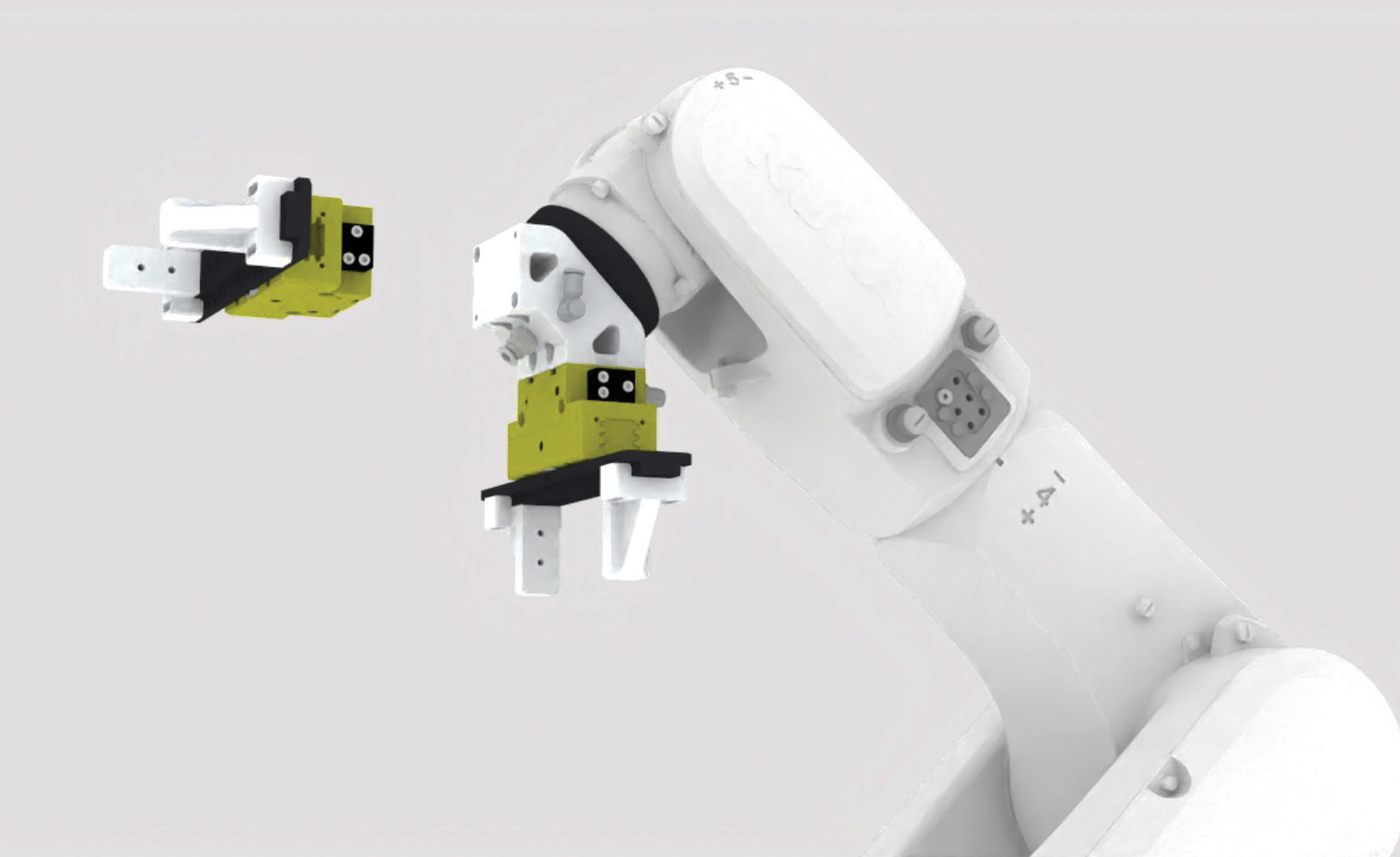 The SYIL R1 automation package includes a standard pneumatic clamping force block and an optional dual gripper, used when the finished part is a different shape from the blank.